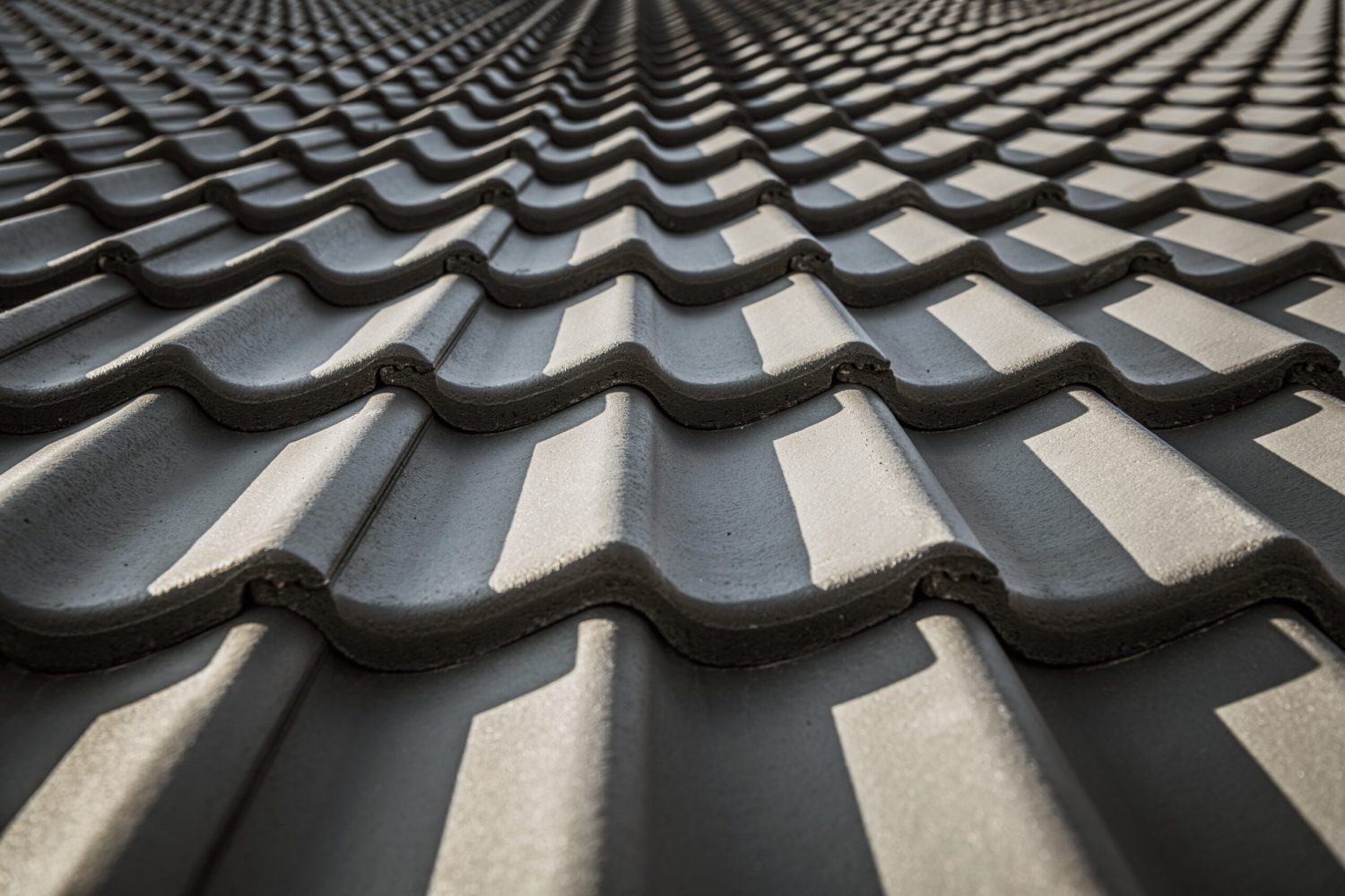 Black Ceramic Roof Tiles Pattern. House Roofing. Construction Industry Materials.